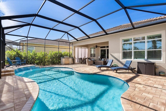 outdoor pool with glass enclosure, outdoor lounge area, a ceiling fan, and a patio