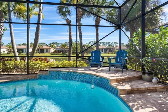 outdoor pool featuring a patio area and glass enclosure