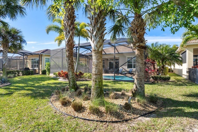 view of yard featuring a lanai and an outdoor pool