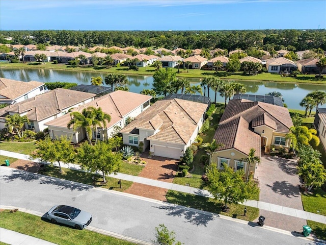 birds eye view of property featuring a water view and a residential view