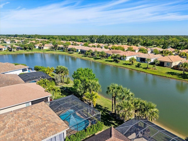 birds eye view of property with a water view and a residential view