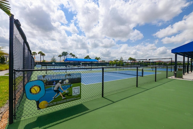 view of tennis court with fence