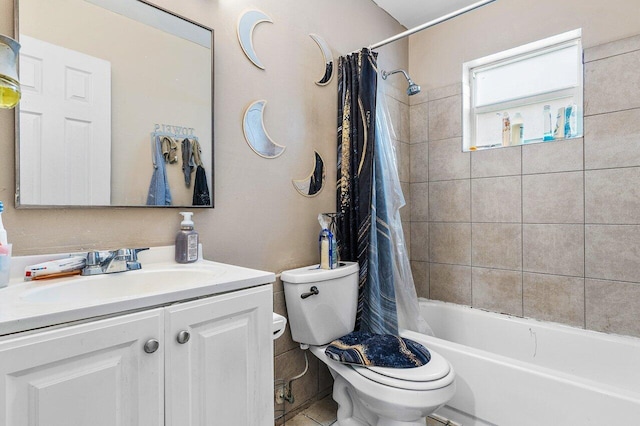 bathroom featuring toilet, shower / tub combo with curtain, and vanity