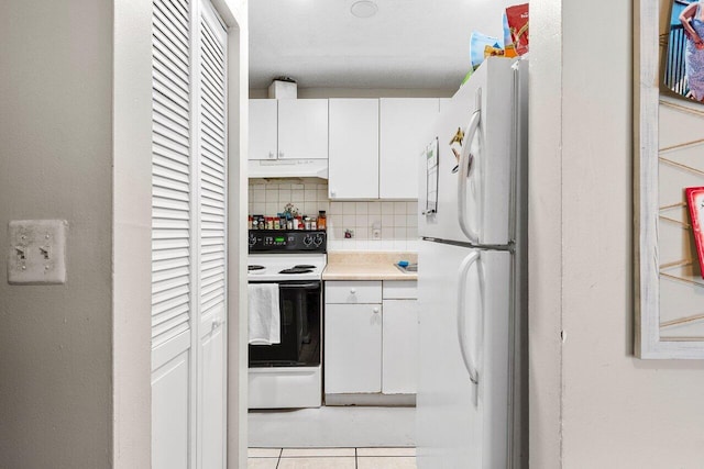 kitchen with white appliances, decorative backsplash, light countertops, under cabinet range hood, and white cabinetry