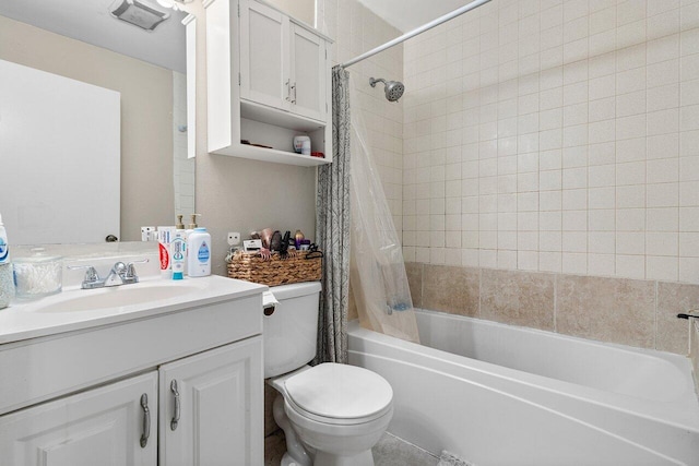 bathroom with vanity, shower / tub combo, and toilet