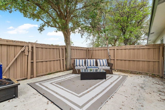 view of patio featuring an outdoor hangout area and a fenced backyard