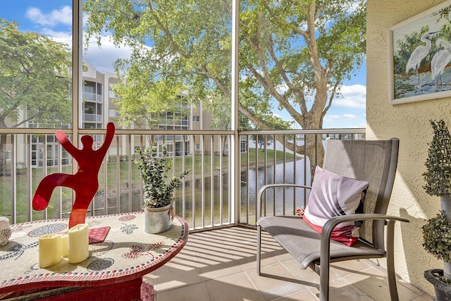 balcony featuring a water view