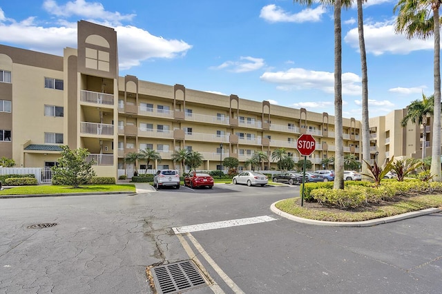 view of property with uncovered parking