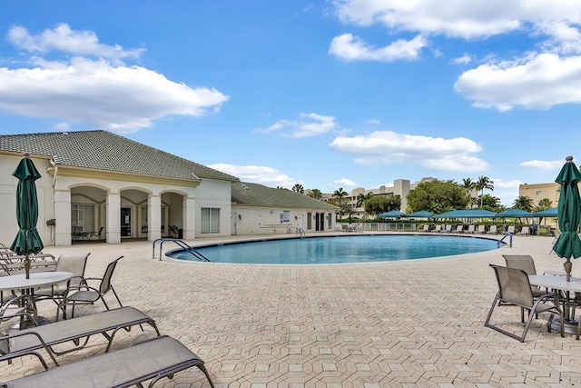 community pool with a patio