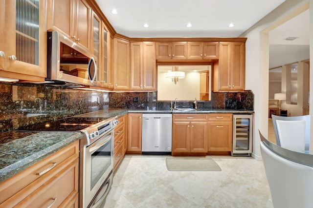 kitchen with decorative backsplash, wine cooler, glass insert cabinets, appliances with stainless steel finishes, and a sink