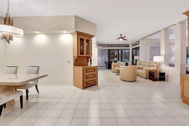 living room featuring light tile patterned floors and a ceiling fan