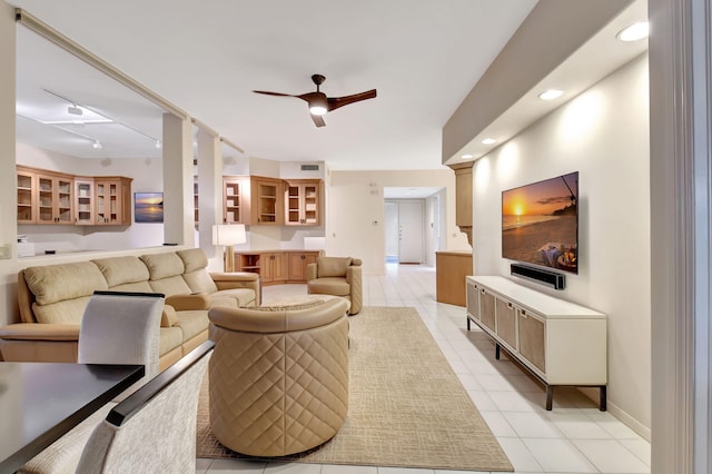 living room featuring visible vents, baseboards, ceiling fan, light tile patterned flooring, and recessed lighting