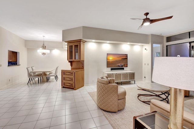 living room featuring ceiling fan and light tile patterned floors