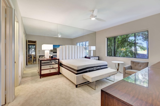 bedroom featuring light carpet