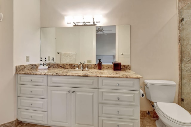 bathroom with ceiling fan, vanity, and toilet