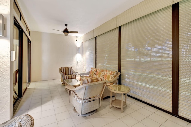 tiled living room featuring a ceiling fan