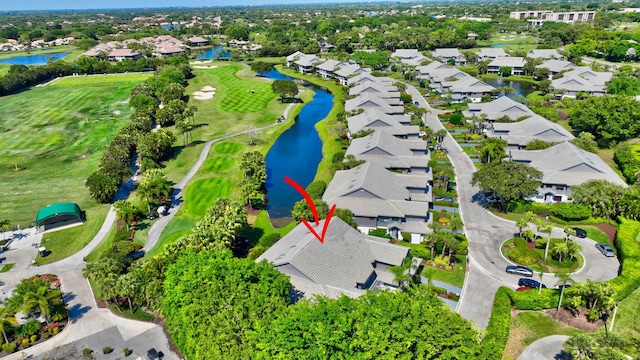 bird's eye view featuring a residential view, view of golf course, and a water view