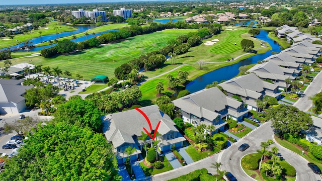 birds eye view of property featuring a water view, a residential view, and golf course view