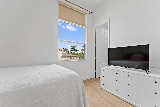 bedroom with light wood finished floors