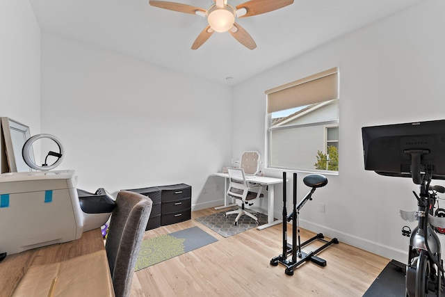 home office featuring wood finished floors, baseboards, and ceiling fan