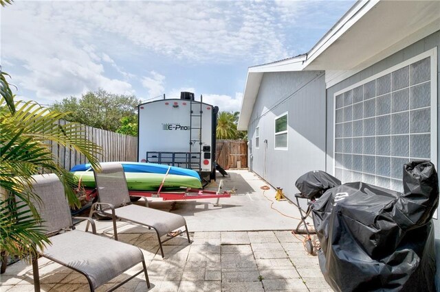 view of patio featuring a fenced backyard and area for grilling