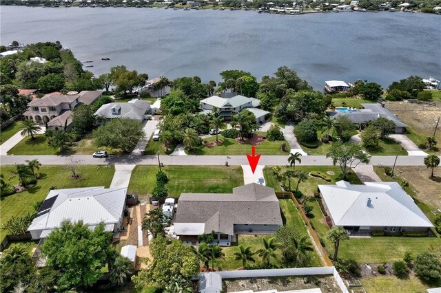 bird's eye view with a water view and a residential view