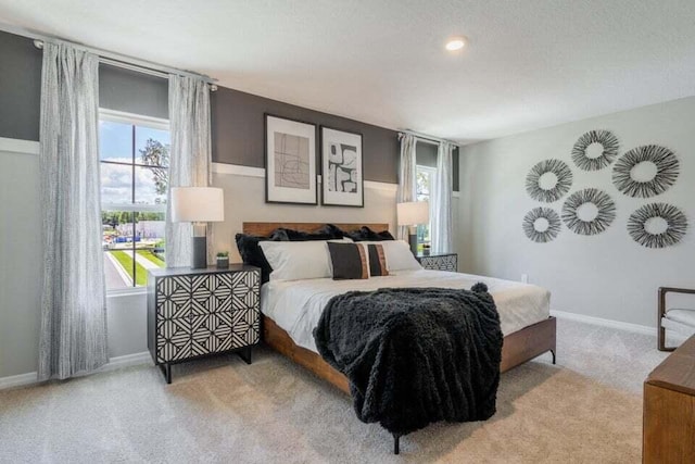 carpeted bedroom with baseboards