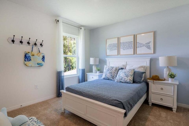 carpeted bedroom with baseboards