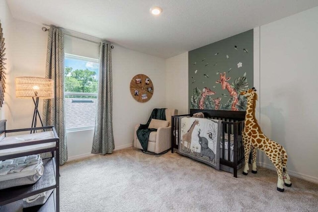 carpeted bedroom featuring baseboards