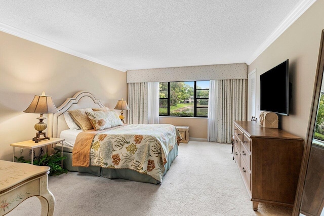 bedroom featuring a textured ceiling, ornamental molding, baseboards, and light carpet