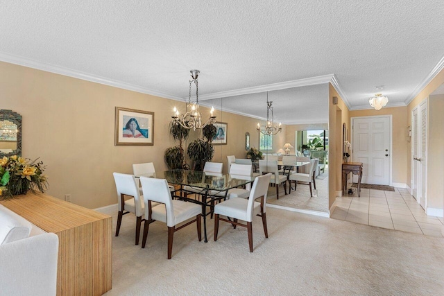 dining room featuring a chandelier, light colored carpet, a textured ceiling, and crown molding