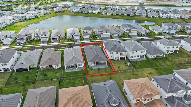 aerial view featuring a residential view and a water view