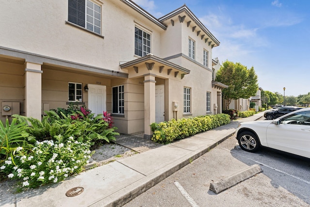 view of side of property featuring stucco siding