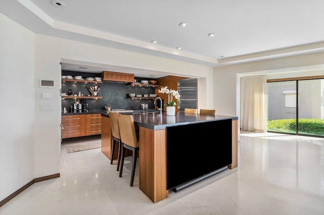 bar with a raised ceiling, backsplash, recessed lighting, wet bar, and baseboards