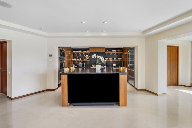 bar with indoor wet bar, recessed lighting, stainless steel appliances, and baseboards