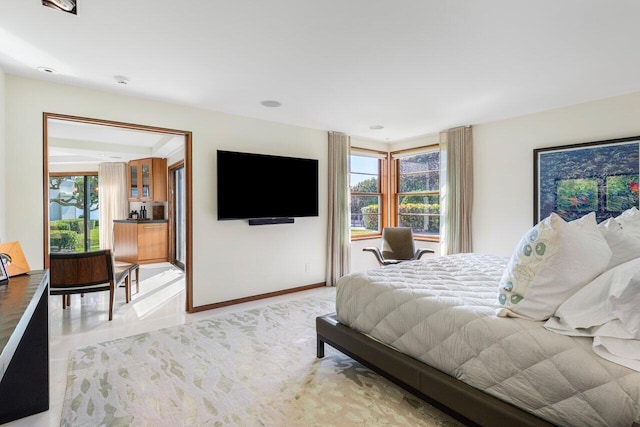 bedroom with multiple windows and baseboards