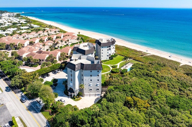 birds eye view of property featuring a residential view, a water view, and a view of the beach