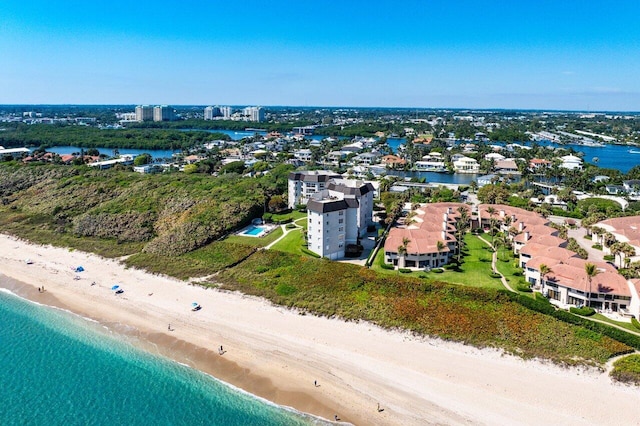 birds eye view of property featuring a view of the beach and a water view