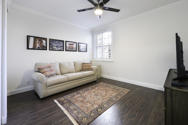 living area with baseboards, a ceiling fan, ornamental molding, and dark wood-style flooring