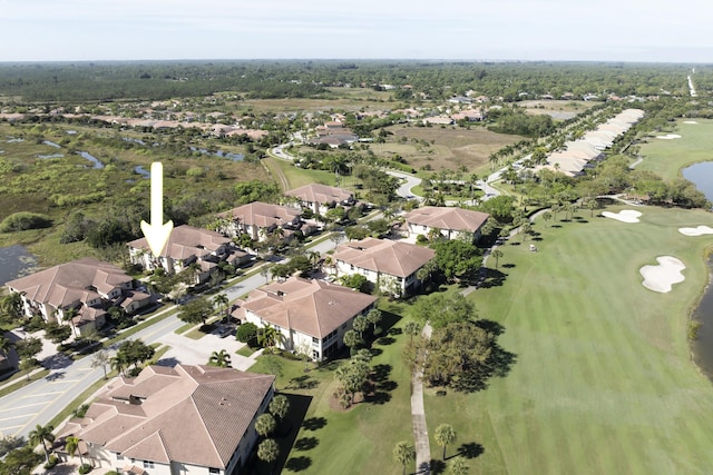 drone / aerial view featuring a residential view and view of golf course