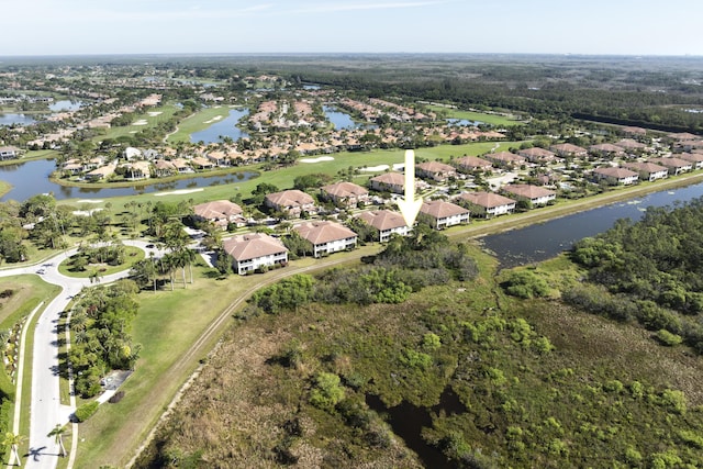 aerial view with a residential view and a water view