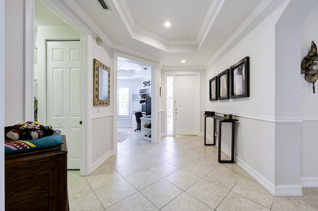 hall featuring visible vents, ornamental molding, recessed lighting, light tile patterned flooring, and a raised ceiling