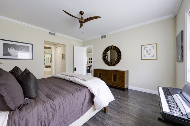 bedroom with dark wood finished floors, visible vents, and ornamental molding