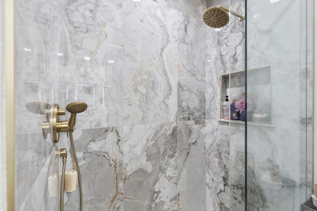 full bathroom featuring a marble finish shower