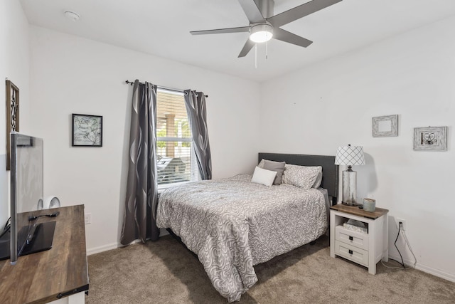 bedroom featuring light carpet, ceiling fan, and baseboards