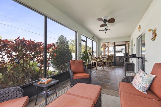 sunroom with a ceiling fan