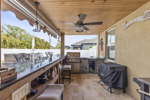 view of patio with a grill, a ceiling fan, a fenced backyard, and area for grilling