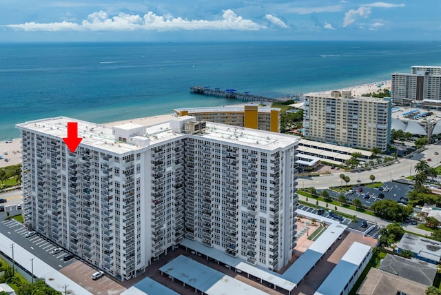 birds eye view of property featuring a view of city and a water view