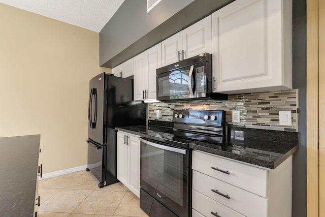 kitchen featuring black appliances, light tile patterned floors, white cabinets, and decorative backsplash