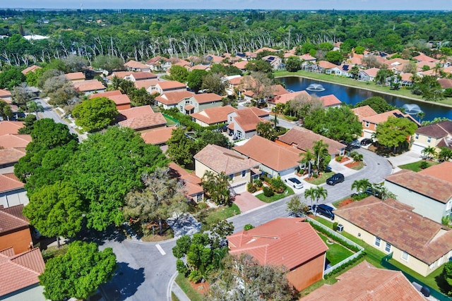 bird's eye view featuring a water view and a residential view